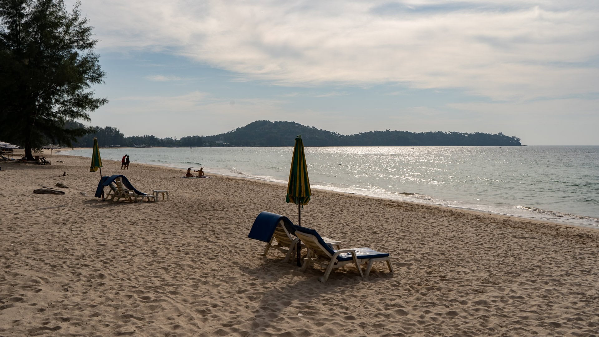 Loungers on Bang Tao Beach during a calm late afternoon.