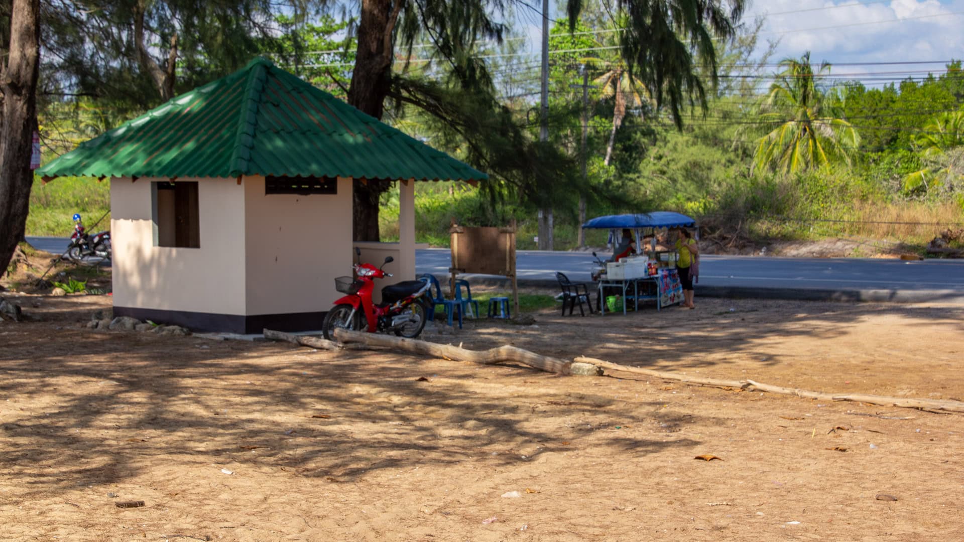 Sai Kaew Beach Phuket parking area with small vendor cart and shelter near Route 402.