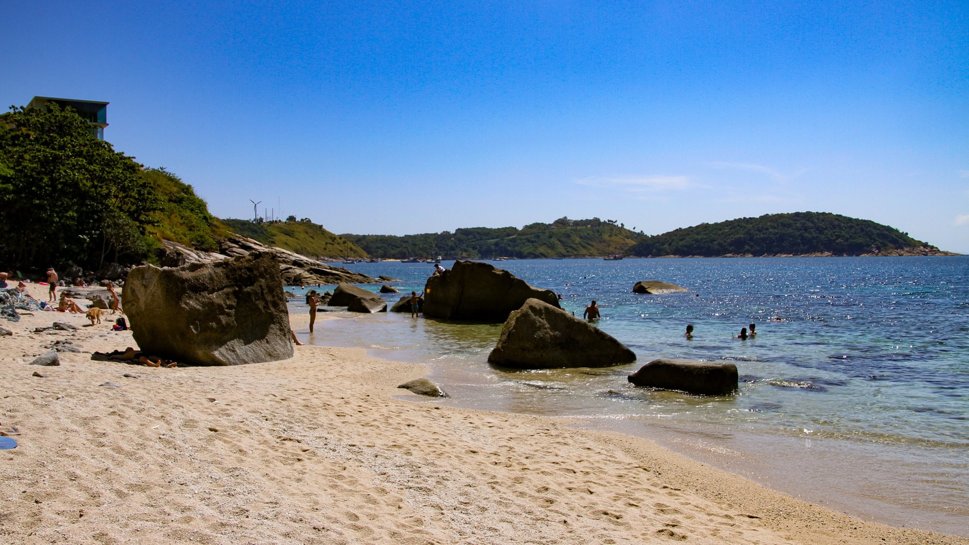 Ao Sane Beach Phuket rocky headland with clear shallow water