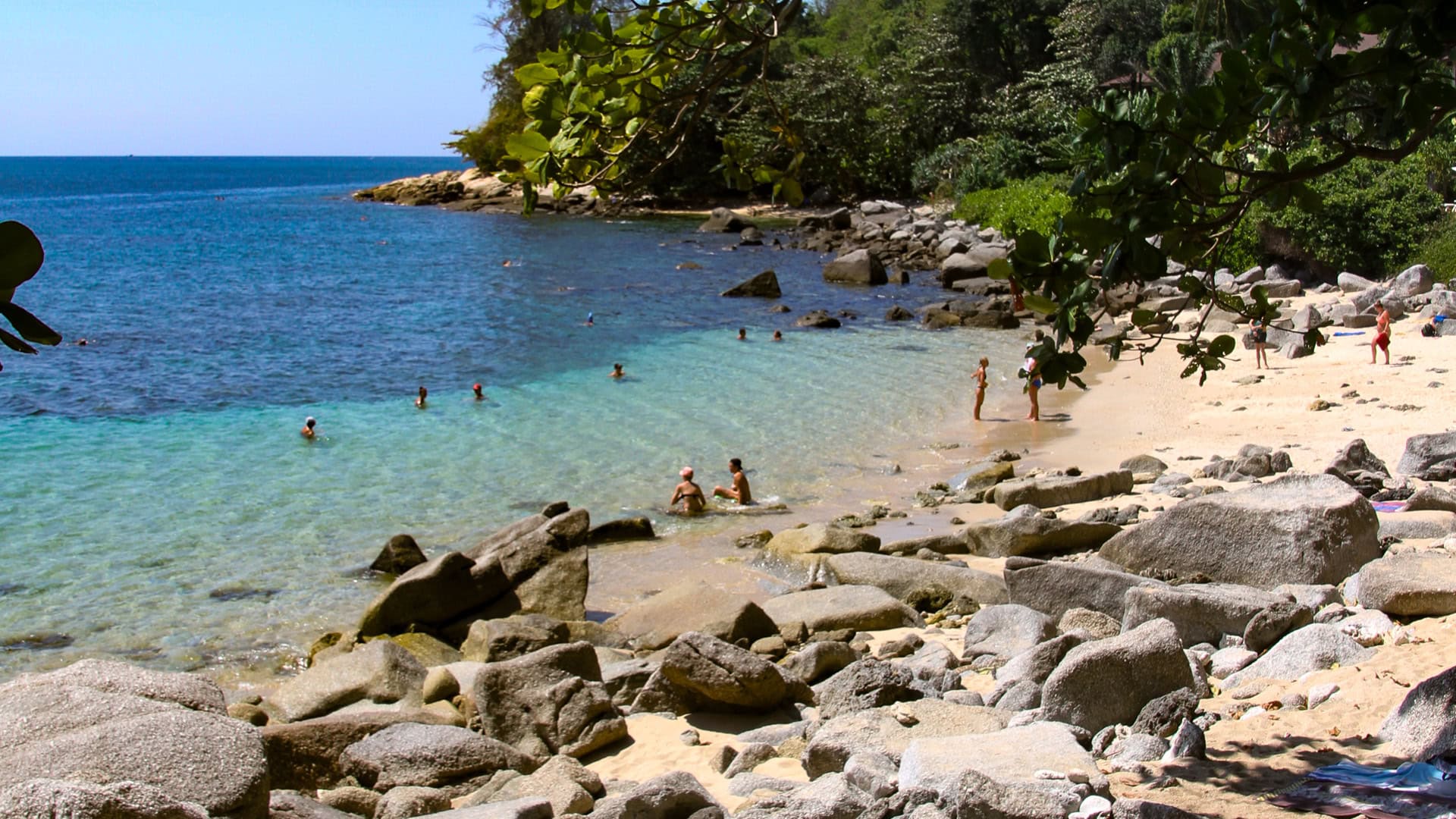 Ao Sane Beach Phuket rocky beach section with uneven sand and stones