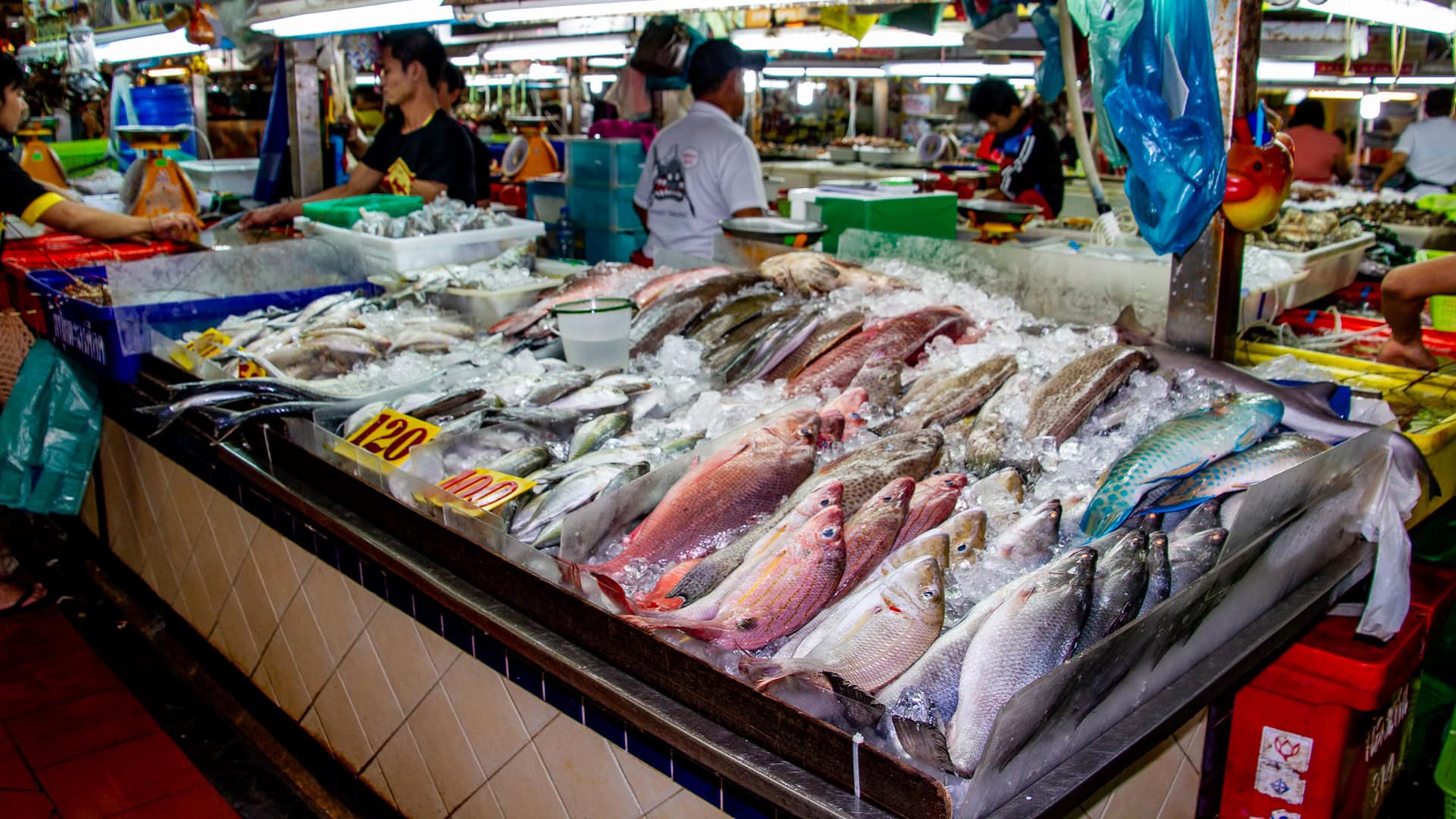 Banzaan Fresh Market Phuket seafood section with whole fish arranged on ice at a market counter.