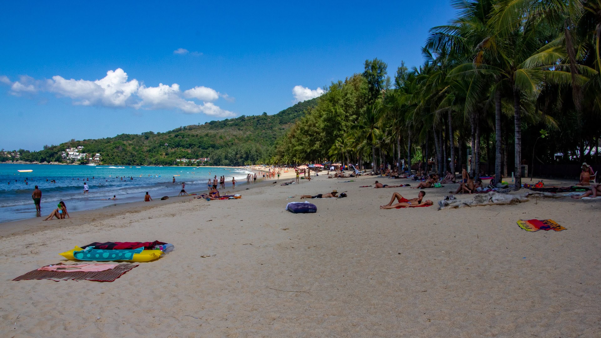 Palm-tree section and beach access point at Kamala Beach Phuket.