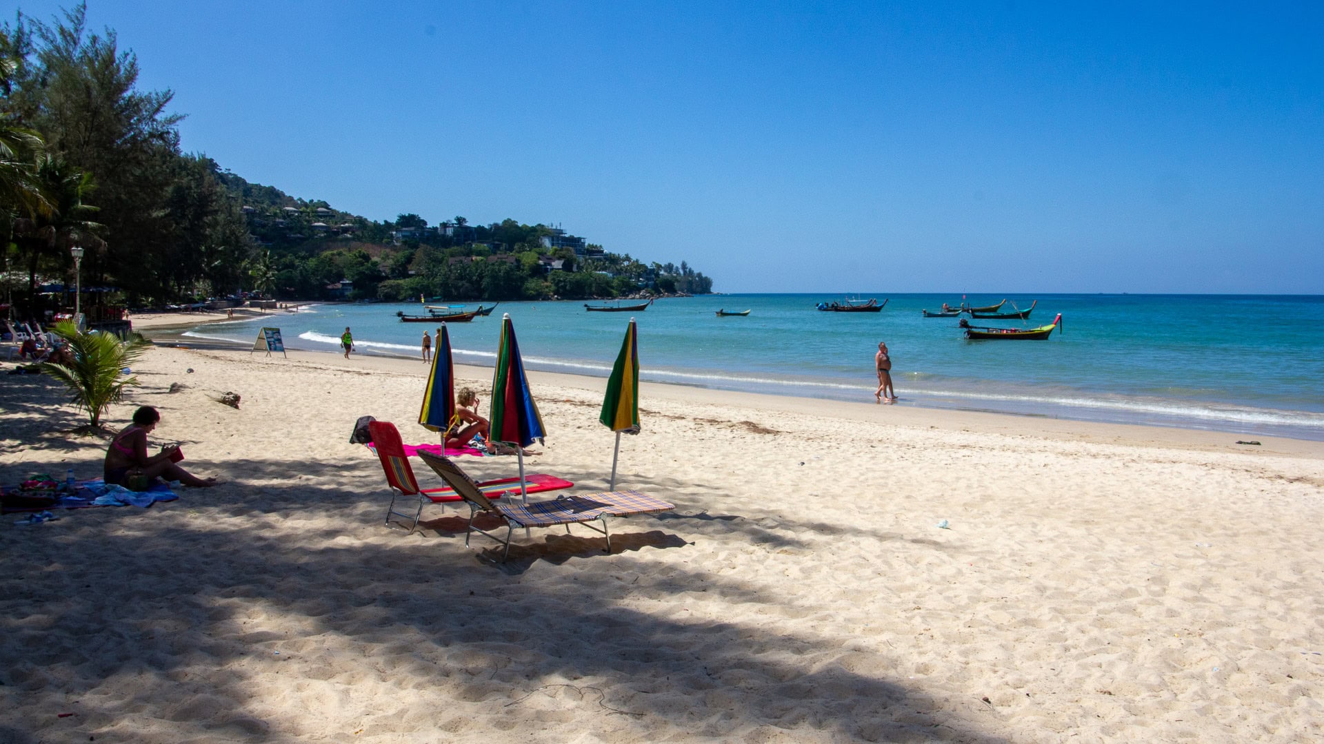 Southern curve of Kamala Beach Phuket with open sand and bay panorama.