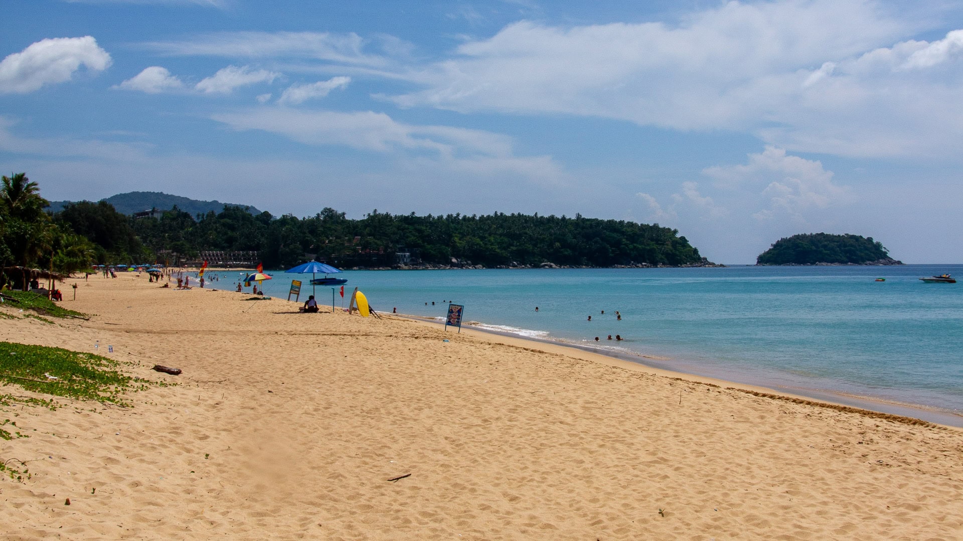 Wide sandy beach at Karon Beach Phuket with boats offshore