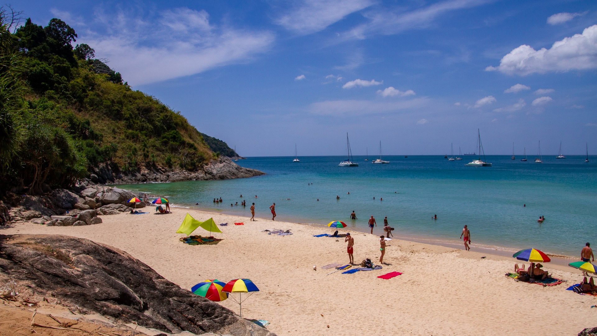 Nai Harn Beach Phuket elevated view of crescent bay with swimmers and white sand