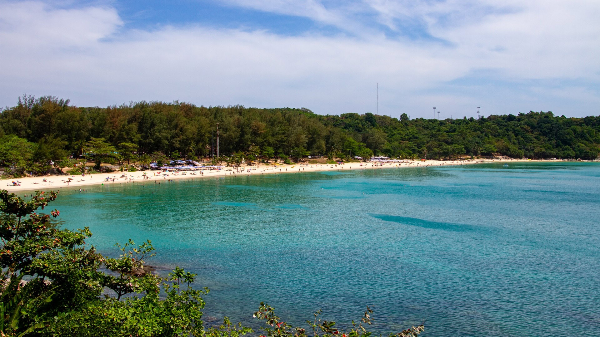 Nai Harn Beach Phuket quiet sandy stretch with calm water and distant yachts
