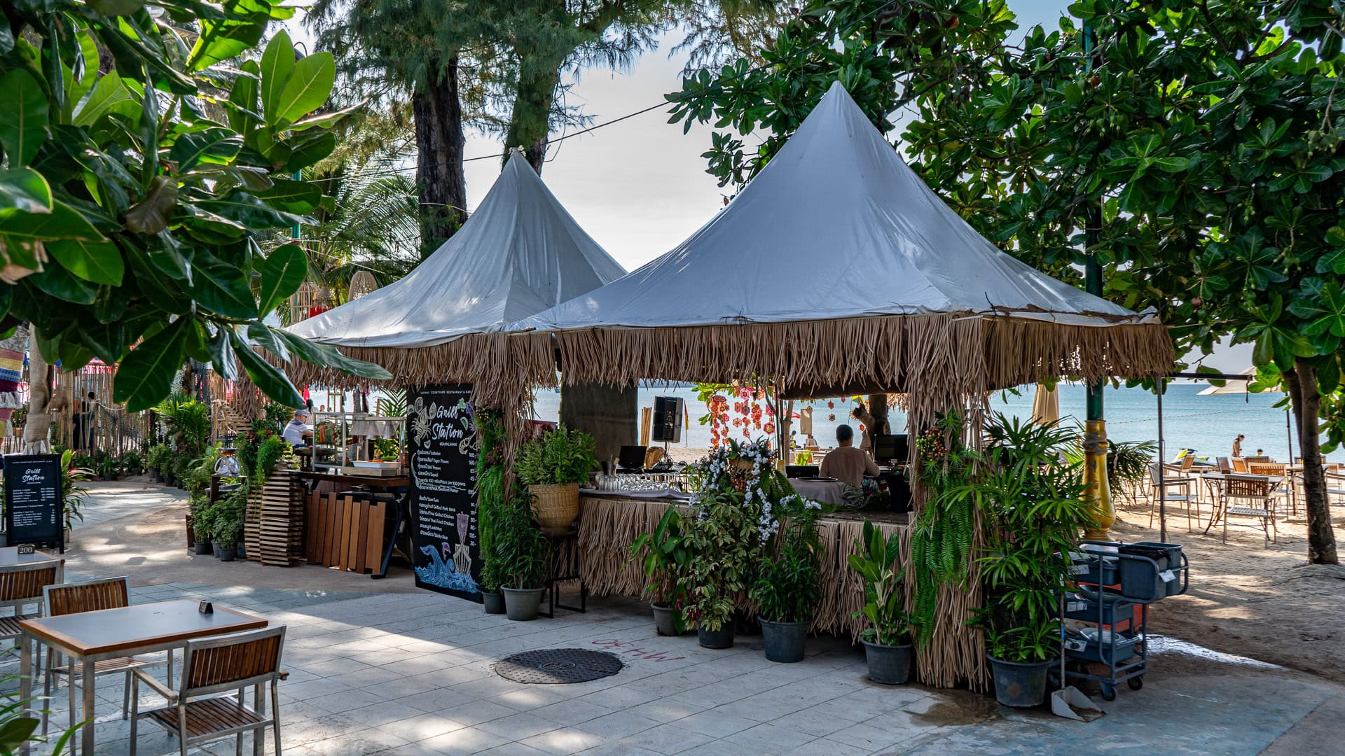 Patong Beach Phuket beachfront bar structure with tables and plants