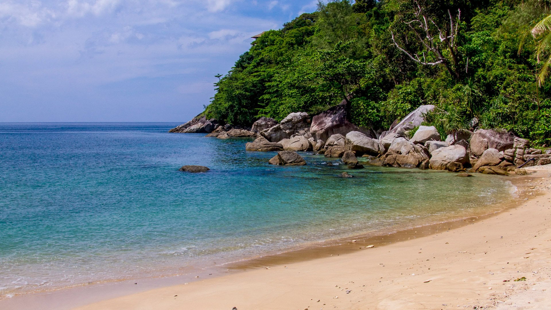 Yae Beach Phuket view of rocky shoreline and clear water near the headland