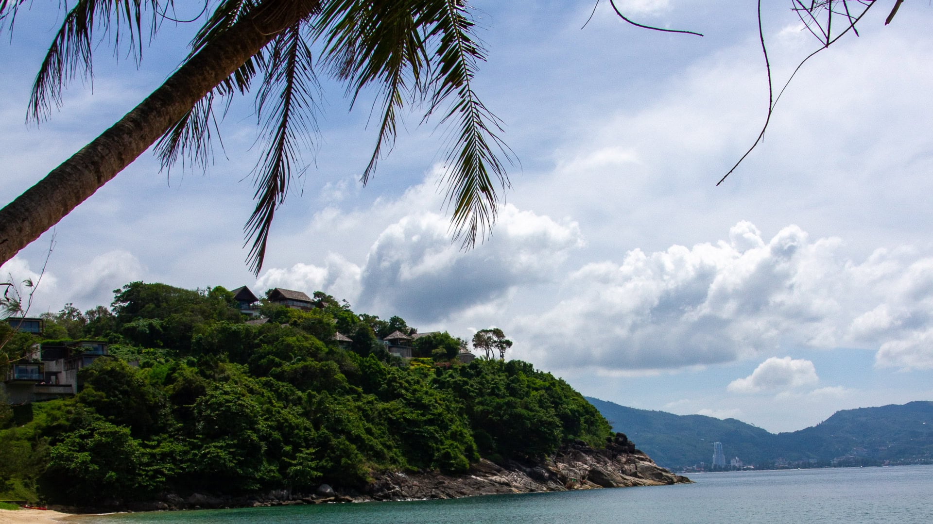 Yae Beach Phuket sheltered bay with resort buildings set back in greenery