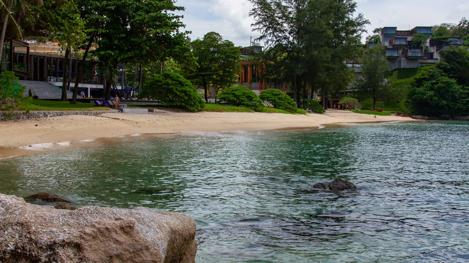 Yae Beach Phuket sandy beach with clear water and rocky seabed visible