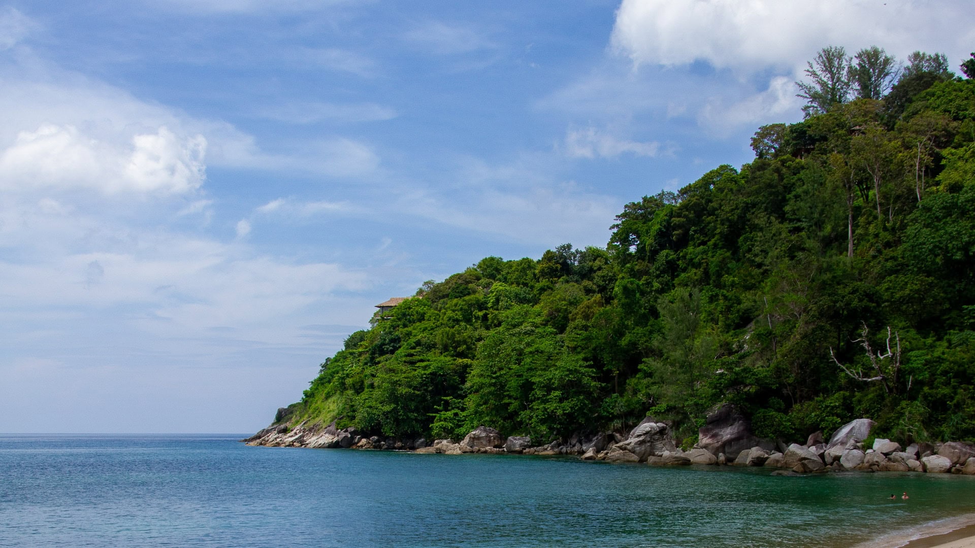Yae Beach Phuket quiet shoreline with jungle-covered headland and sea