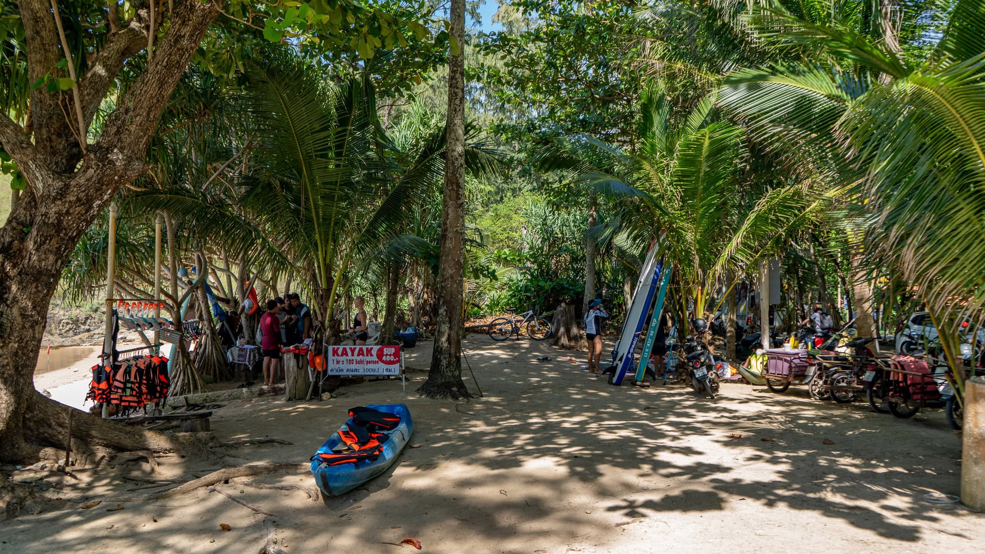 Yanui Beach Phuket shaded area with kayak rental and trees