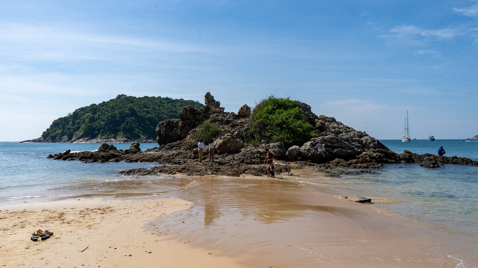 Yanui Beach Phuket narrow sand strip leading to rocky islet