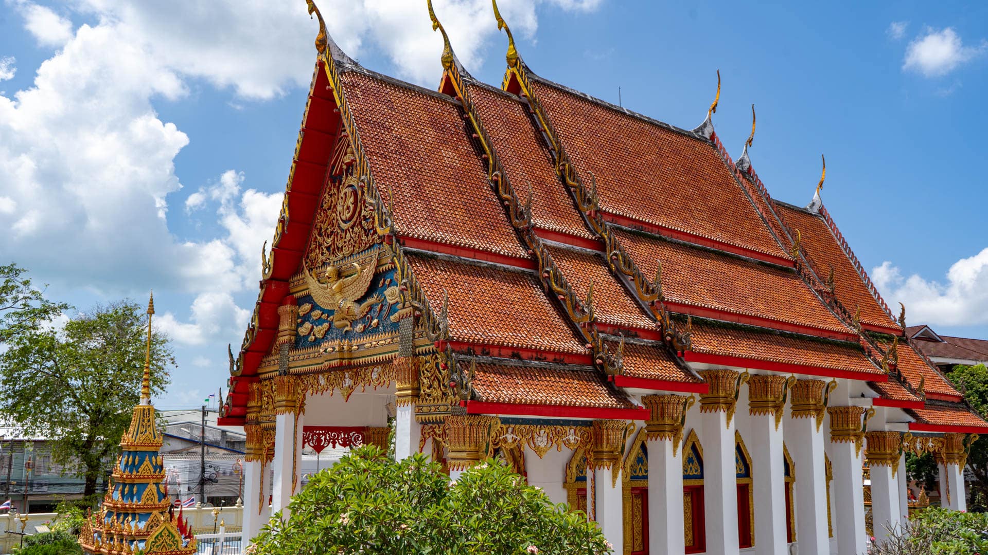 Ornate ordination hall roof and façade at Wat Mongkolnimit temple